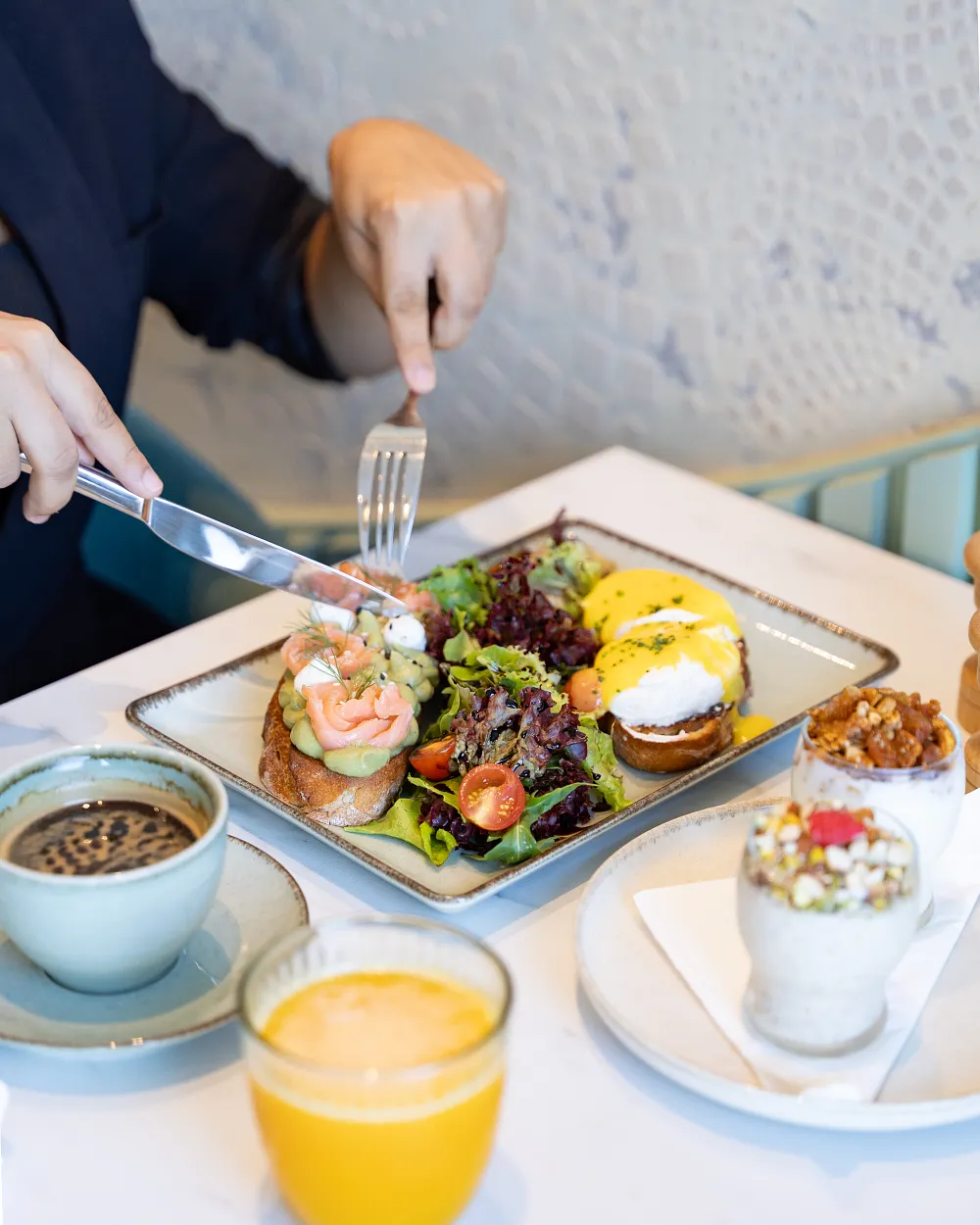 Oslo brunch with avocado toast, poached eggs and smoked salmon
